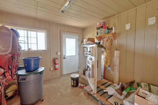 interior space featuring wooden walls