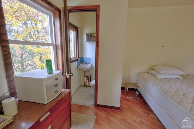 bedroom with light wood-type flooring