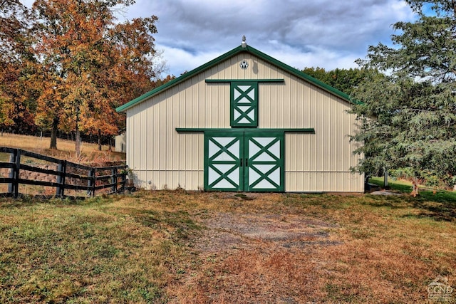 view of outbuilding with a lawn