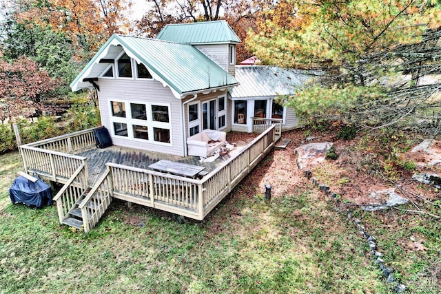 rear view of property with a deck