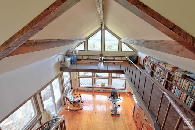 additional living space with beamed ceiling, high vaulted ceiling, and hardwood / wood-style flooring