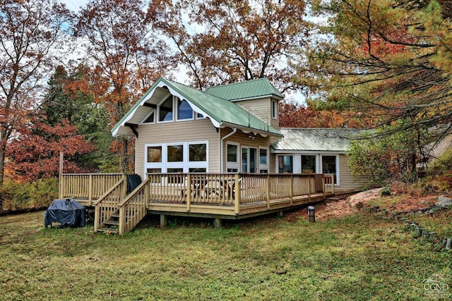 back of house with a yard and a wooden deck