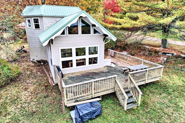 back of property featuring a wooden deck