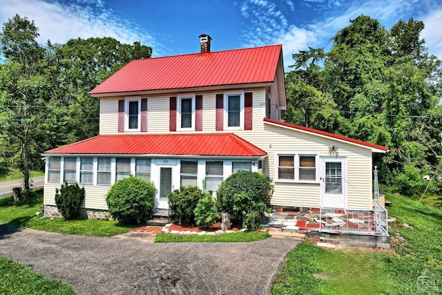 view of front facade featuring a sunroom