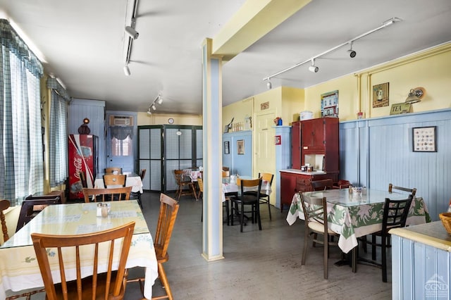 dining area featuring track lighting