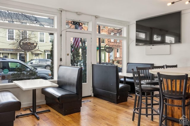 dining space with light hardwood / wood-style flooring