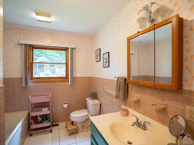 bathroom with tile patterned floors, toilet, a tub, and tile walls