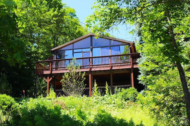 rear view of property with a deck