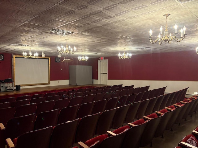 home theater room with a chandelier