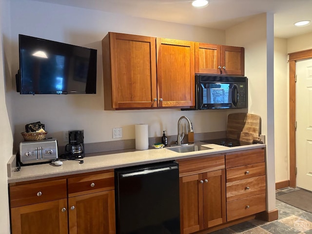 kitchen with sink and black appliances