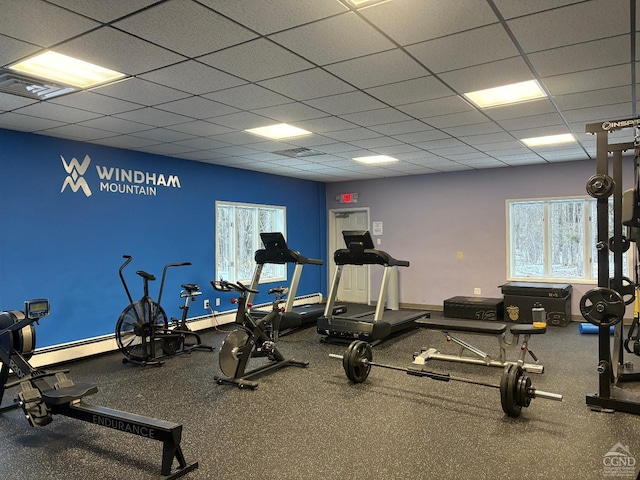 exercise room featuring a paneled ceiling