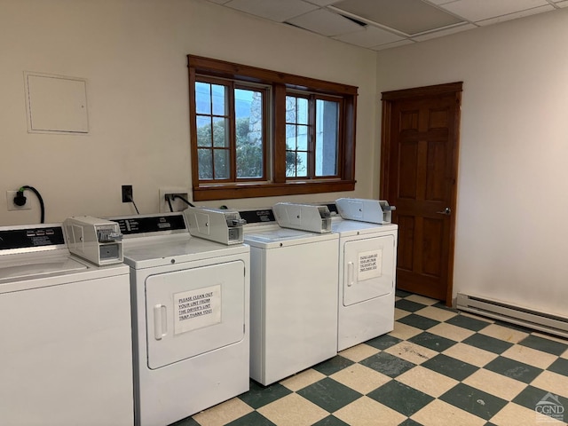 laundry room featuring washer and clothes dryer and a baseboard heating unit