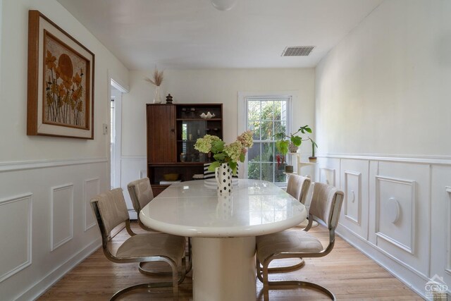 dining room with light hardwood / wood-style flooring