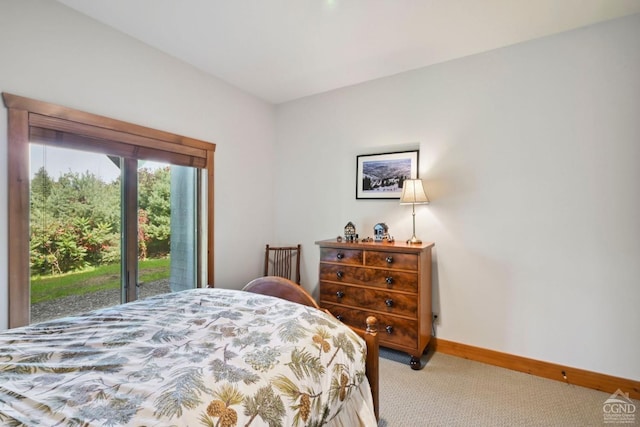 carpeted bedroom with access to outside