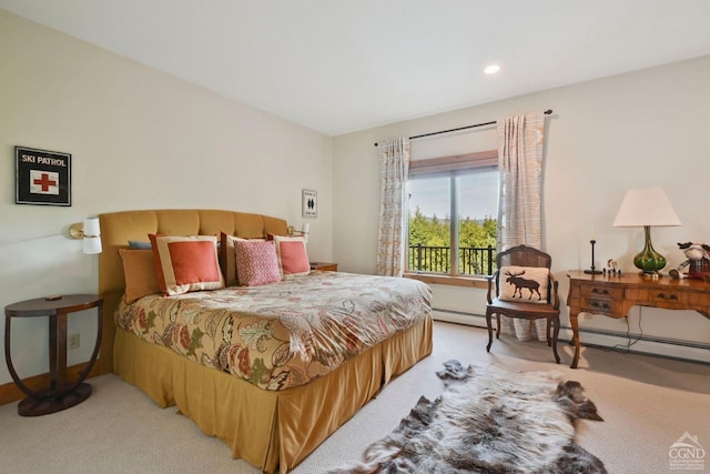 carpeted bedroom with a baseboard radiator