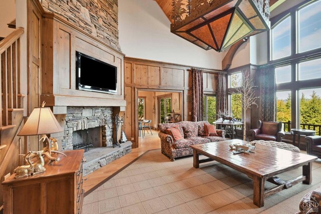 sunroom with a fireplace and vaulted ceiling