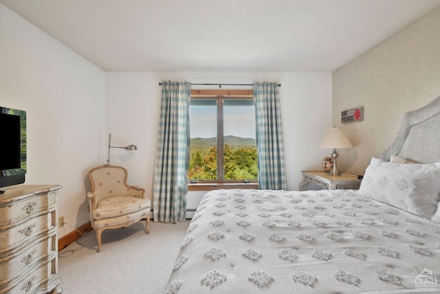 bedroom featuring carpet flooring and baseboard heating