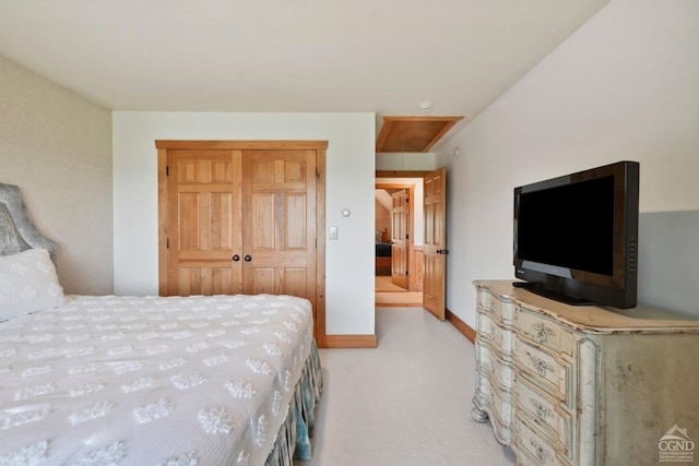 carpeted bedroom with a closet