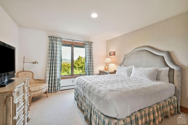 carpeted bedroom featuring baseboard heating