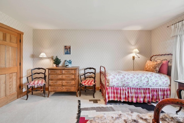 bedroom featuring light colored carpet