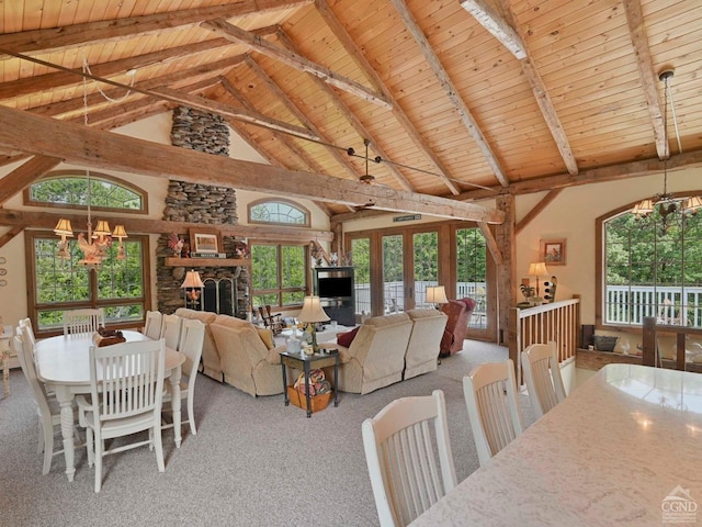 carpeted dining space featuring an inviting chandelier, wood ceiling, beam ceiling, and high vaulted ceiling