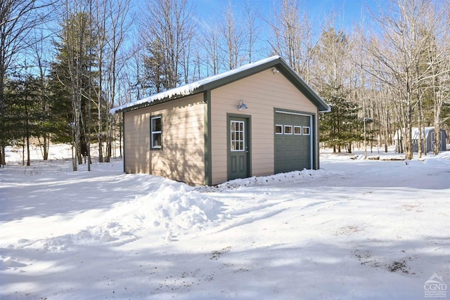 view of snow covered garage