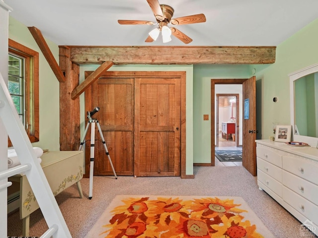 bedroom featuring ceiling fan and light carpet