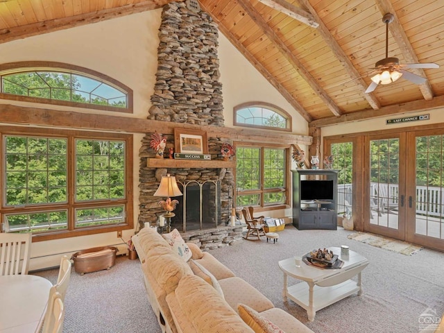 carpeted living room featuring french doors, beam ceiling, wood ceiling, ceiling fan, and a fireplace