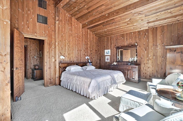 carpeted bedroom featuring wooden walls, wooden ceiling, and high vaulted ceiling