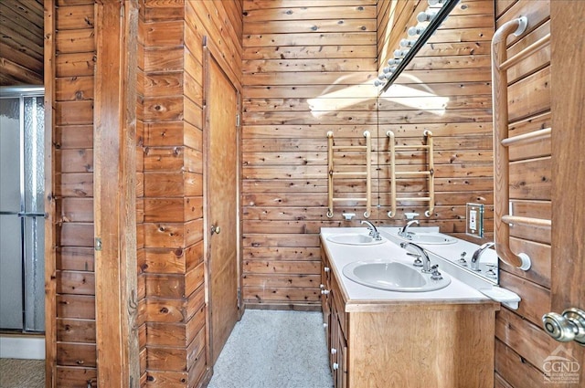 full bath with a sink and wooden walls