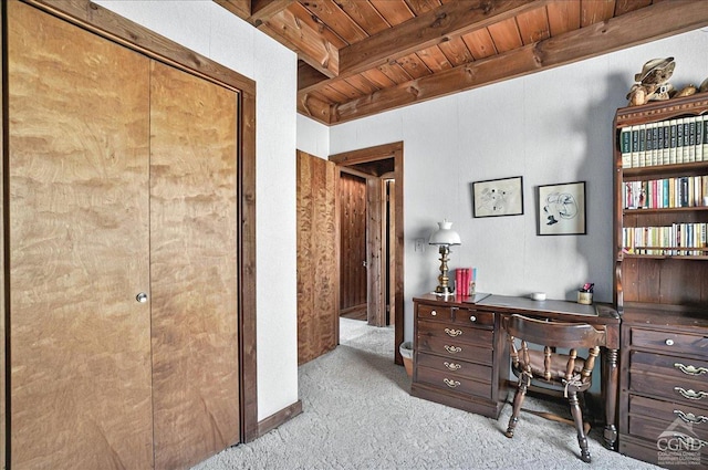 home office with wooden ceiling, carpet flooring, and beam ceiling
