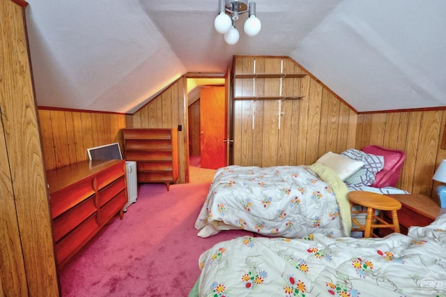 carpeted bedroom with wood walls, lofted ceiling, radiator heating unit, and ceiling fan
