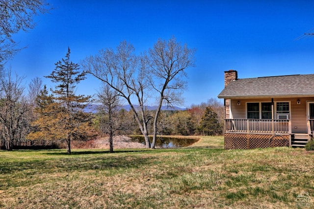 view of yard with a wooden deck