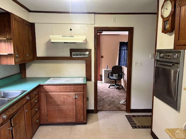 kitchen featuring sink, backsplash, white electric cooktop, oven, and ornamental molding