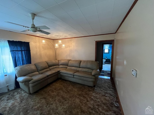 living room with dark carpet, ceiling fan, and ornamental molding