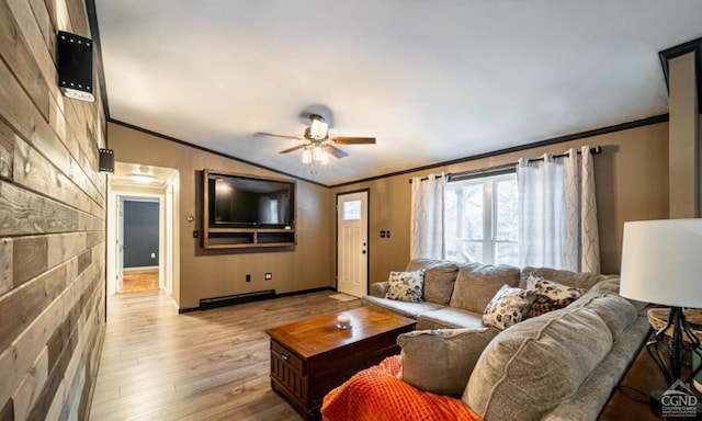 living room featuring ceiling fan, vaulted ceiling, crown molding, and light hardwood / wood-style flooring