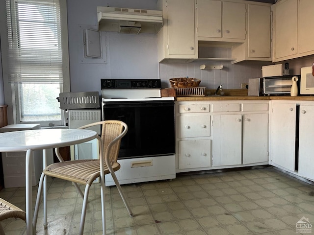 kitchen featuring white range with electric cooktop and white cabinets