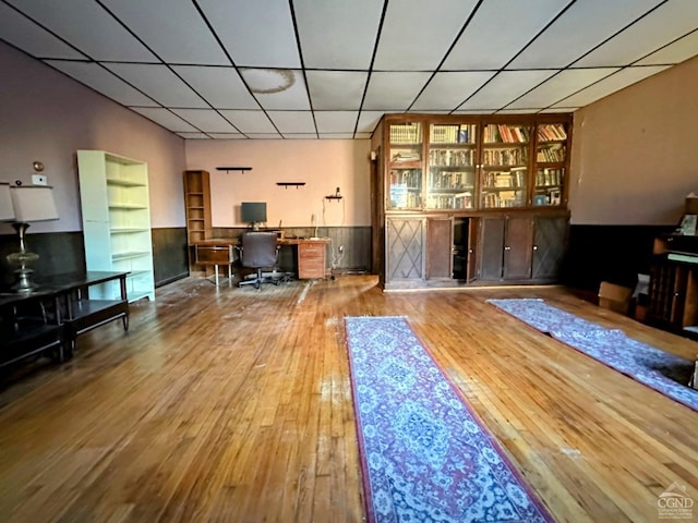 home office with hardwood / wood-style flooring and built in features