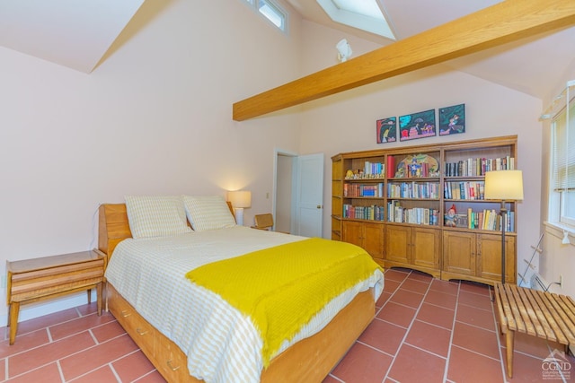 tiled bedroom featuring beam ceiling and high vaulted ceiling