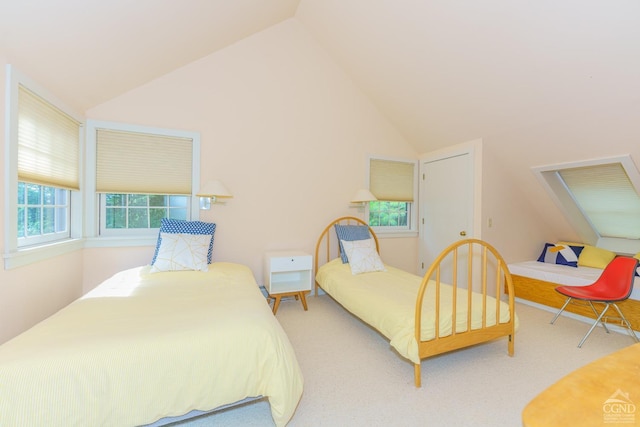 carpeted bedroom with vaulted ceiling