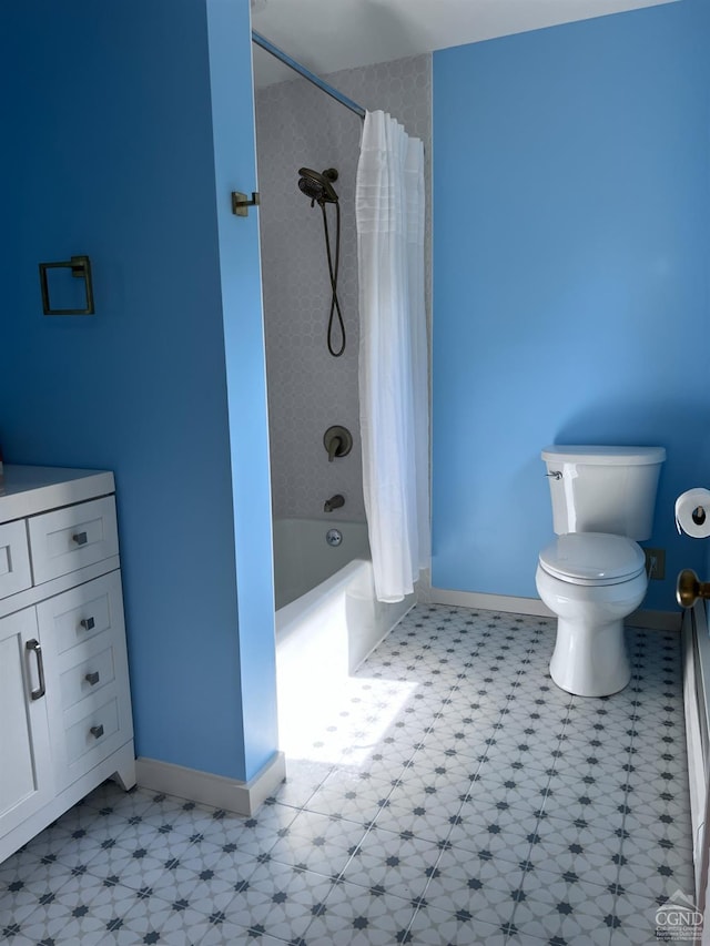 full bathroom featuring tile patterned flooring, vanity, shower / bath combo, and toilet