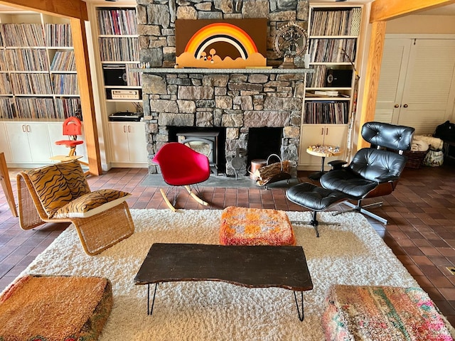 living room with built in shelves and a fireplace