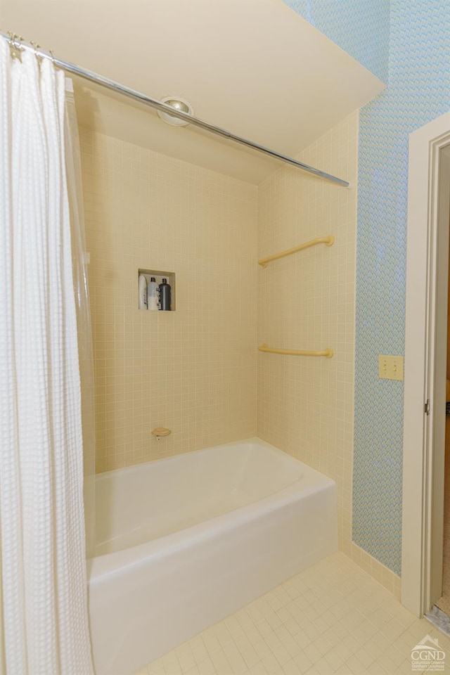 bathroom featuring tile patterned flooring and shower / tub combo