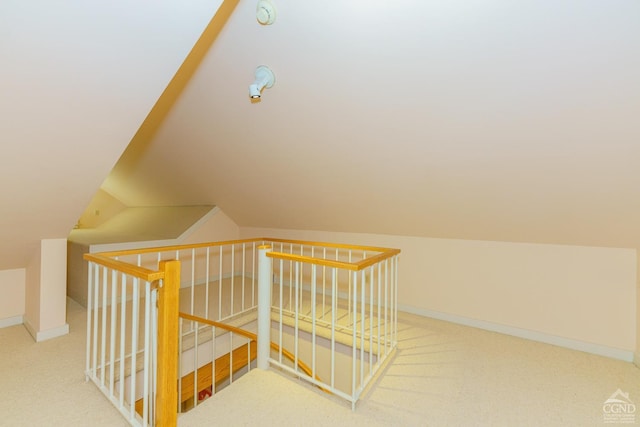 interior space featuring carpet and lofted ceiling