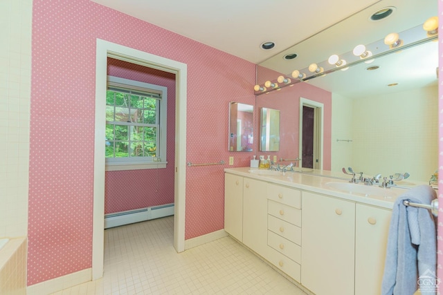 bathroom featuring tile patterned floors, vanity, and a baseboard heating unit