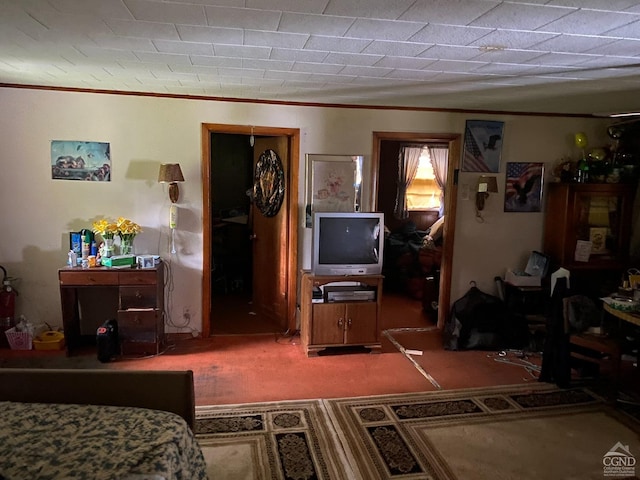 bedroom with carpet flooring and crown molding