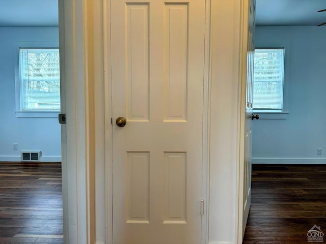 details with visible vents, baseboards, and wood finished floors