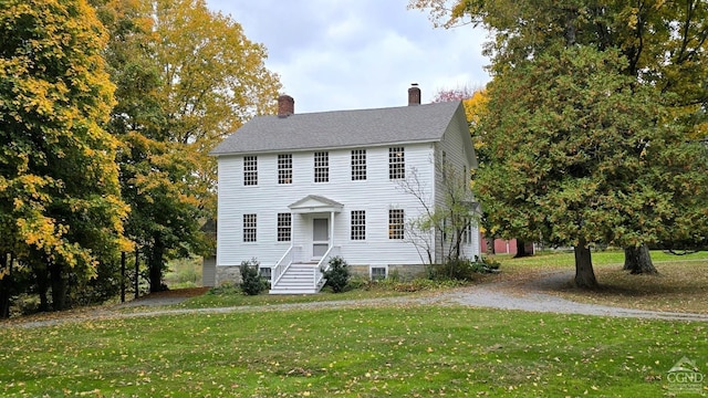 colonial home with a front yard