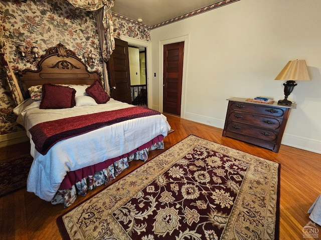 bedroom featuring hardwood / wood-style flooring and a closet