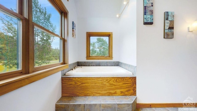 bathroom with tiled bath